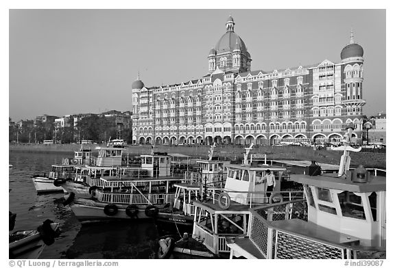 Tour boats and Taj Mahal Palace Hotel. Mumbai, Maharashtra, India (black and white)