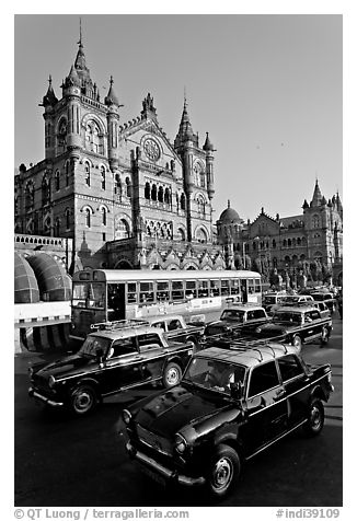 Black and Yellow cabs in front of Victoria Terminus. Mumbai, Maharashtra, India (black and white)