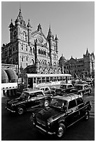Black and Yellow cabs in front of Victoria Terminus. Mumbai, Maharashtra, India (black and white)