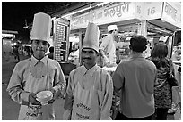 Cooks in front of Panipuri stall, Chowpatty Beach. Mumbai, Maharashtra, India (black and white)