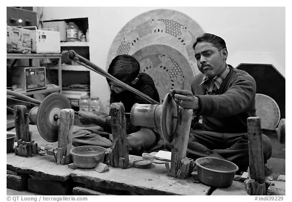 Men polishing marble. Agra, Uttar Pradesh, India (black and white)