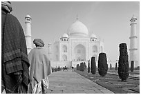 Men with turbans walking toward Taj Mahal, early morning. Agra, Uttar Pradesh, India ( black and white)