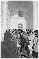 Women in front of main Iwan, Taj Mahal,. Agra, Uttar Pradesh, India ( black and white)