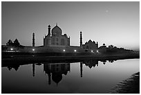 Taj Mahal complex reflected in Yamuna River at sunset. Agra, Uttar Pradesh, India ( black and white)