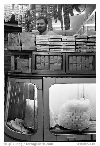 Store selling peitha squares, a local sweet. Agra, Uttar Pradesh, India (black and white)