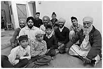 Sikh men and boys in gurdwara. Bharatpur, Rajasthan, India ( black and white)