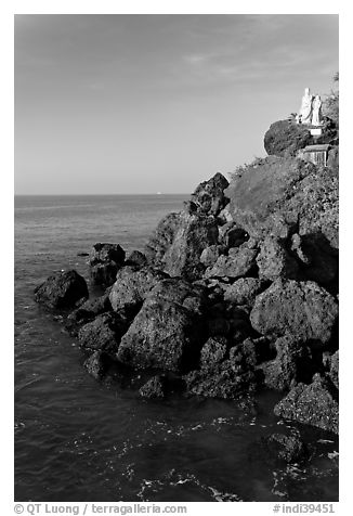 Boulders and christian statues overlooking ocean, Dona Paula. Goa, India (black and white)