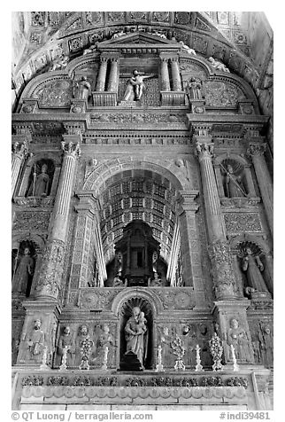 Gilded and carved woodwork, Church of St Francis of Assisi altar, Old Goa. Goa, India (black and white)