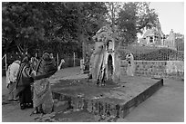 Women throwing water at  Shiva image. Khajuraho, Madhya Pradesh, India ( black and white)