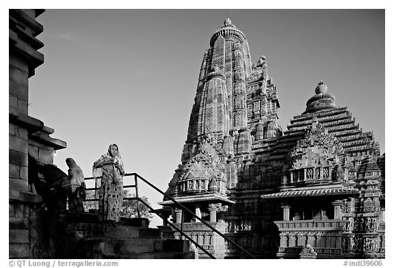 Woman with offering pot in front of Lakshmana temple. Khajuraho, Madhya Pradesh, India (black and white)