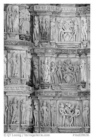 Carvings on the outside of Kadariya-Mahadeva temple including erotic figures. Khajuraho, Madhya Pradesh, India (black and white)