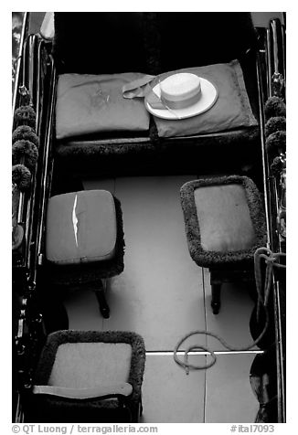 Empty gondola with seats and gondolier's hat. Venice, Veneto, Italy (black and white)