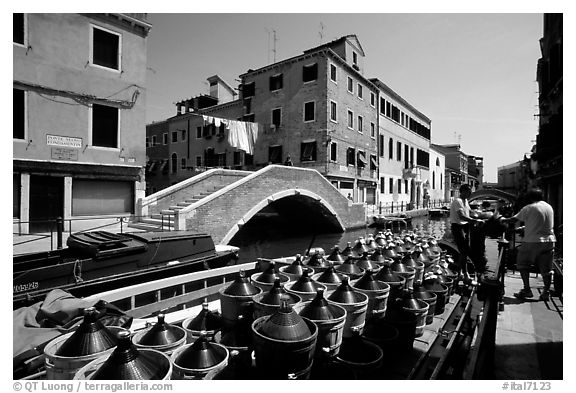 Delivery of wine along a side canal, Castello. Venice, Veneto, Italy (black and white)