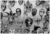 Carnival masks over golden background, Burano. Venice, Veneto, Italy (black and white)