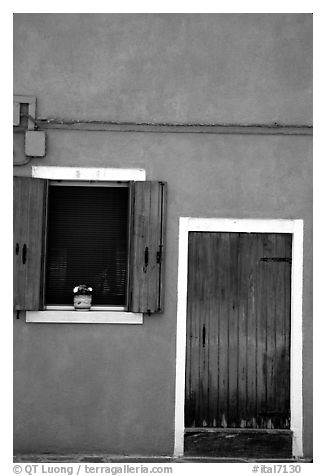 Door, window, pink-colored house,  Burano. Venice, Veneto, Italy (black and white)