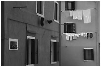 Multicolored houses and hanging laundry, Burano. Venice, Veneto, Italy (black and white)