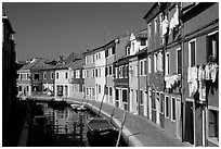 Canal lined with multihued houses, Burano. Venice, Veneto, Italy (black and white)