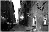 Street and fountain at dawn. Siena, Tuscany, Italy (black and white)