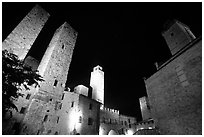Medieval towers above Piazza del Duomo at night. San Gimignano, Tuscany, Italy (black and white)