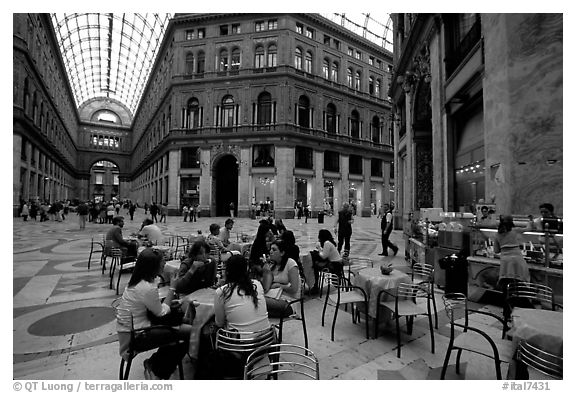 Women enjoy gelato inside the Galleria Umberto I. Naples, Campania, Italy (black and white)