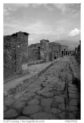 Paved street and ruins. Pompeii, Campania, Italy (black and white)