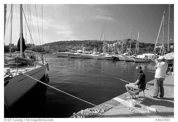 Fishing in the yacht harbor, Agropoli. Campania, Italy (black and white)