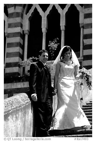 Newly wed couple on the stairs of Duomo Sant'Andrea, Amalfi. Amalfi Coast, Campania, Italy