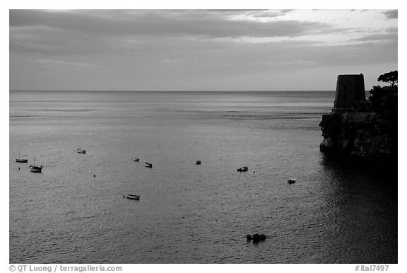 Small boats and tower and sunset, Positano. Amalfi Coast, Campania, Italy (black and white)