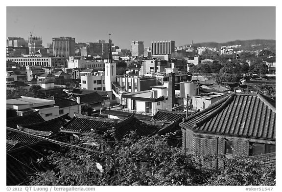 Hanok houses overlooking modern skyline. Seoul, South Korea