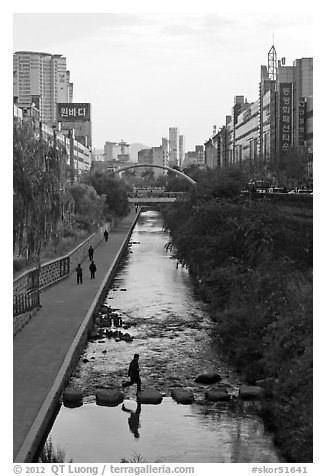 Man crossing Cheonggye stream. Seoul, South Korea