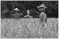 Scarecrows in field. Hahoe Folk Village, South Korea (black and white)