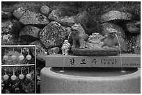 Water fountain and drinking cups, Seokguram. Gyeongju, South Korea (black and white)