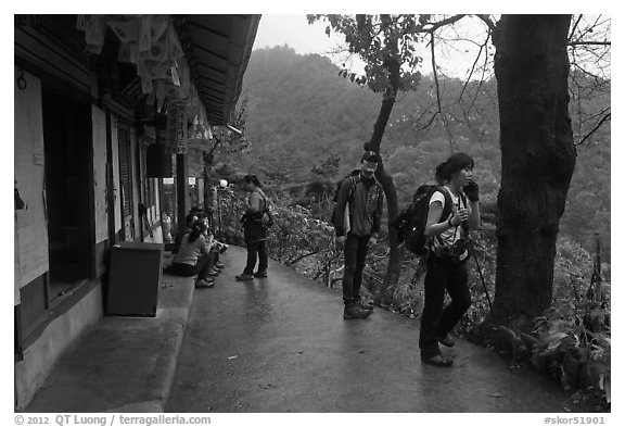 Hikers at Sangseonam hermitage, Samneung Valley, Mt Namsan. Gyeongju, South Korea (black and white)
