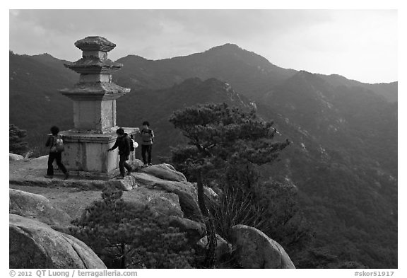 Women circling stone pagoda, Mt Namsan. Gyeongju, South Korea (black and white)