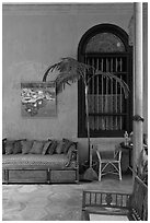 Chairs and blue wall, Cheong Fatt Tze Mansion. George Town, Penang, Malaysia ( black and white)