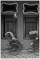 Rickshaws and windows, Cheong Fatt Tze Mansion. George Town, Penang, Malaysia (black and white)