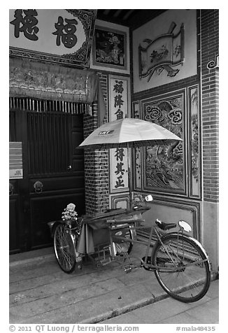 Bicycle rickshaw at temple entrance. George Town, Penang, Malaysia (black and white)