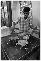 Man preparing indian food. George Town, Penang, Malaysia (black and white)