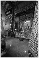 Altar and wheels in motion, Hainan Temple. George Town, Penang, Malaysia (black and white)