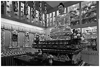 Buddha image inside Yellow Hat Buddhist temple. George Town, Penang, Malaysia ( black and white)