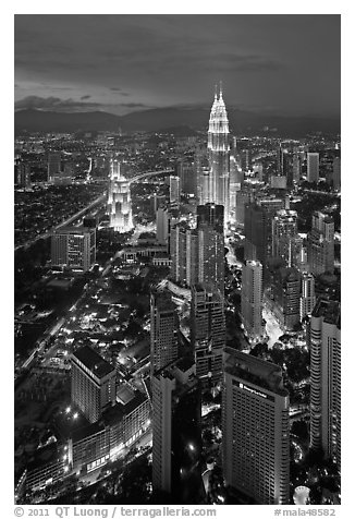 Skyscrappers dominated by Petronas Towers at night. Kuala Lumpur, Malaysia (black and white)