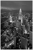 Skyscrappers dominated by Petronas Towers at night. Kuala Lumpur, Malaysia (black and white)
