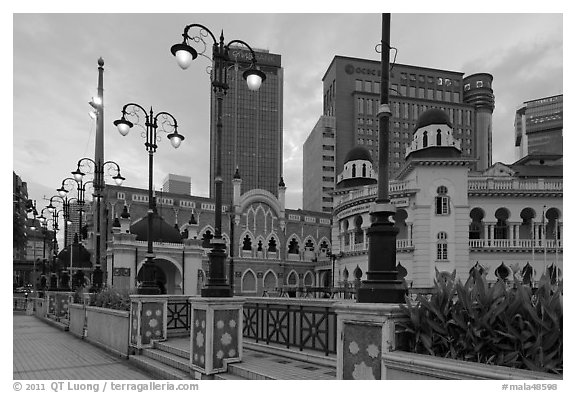 Street lamps and historic buildings at dawn, Merdeka Square. Kuala Lumpur, Malaysia (black and white)