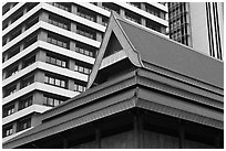 Roof of traditional tek house and modern buildings. Kuala Lumpur, Malaysia ( black and white)