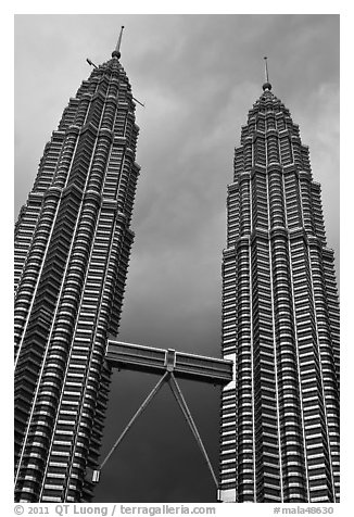 Petronas Towers (tallest twin towers in the world) and stormy sky. Kuala Lumpur, Malaysia (black and white)