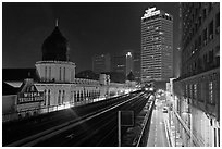 LRT train and tracks in front of Panggung Bandaraya at night. Kuala Lumpur, Malaysia ( black and white)