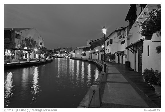 Houses and walkway at dusk, Melaka River. Malacca City, Malaysia (black and white)