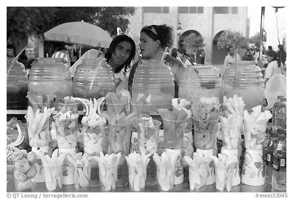 Cups of fresh fruits offered for sale on the street. Guadalajara, Jalisco, Mexico (black and white)