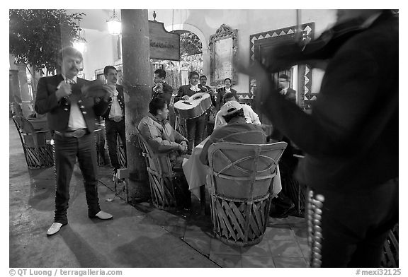 Mariachi musicians performing a serenade at the Parian, Tlaquepaque. Jalisco, Mexico (black and white)
