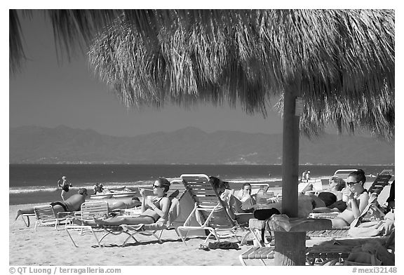 People lying on beach chairs, Nuevo Vallarta, Nayarit. Jalisco, Mexico (black and white)
